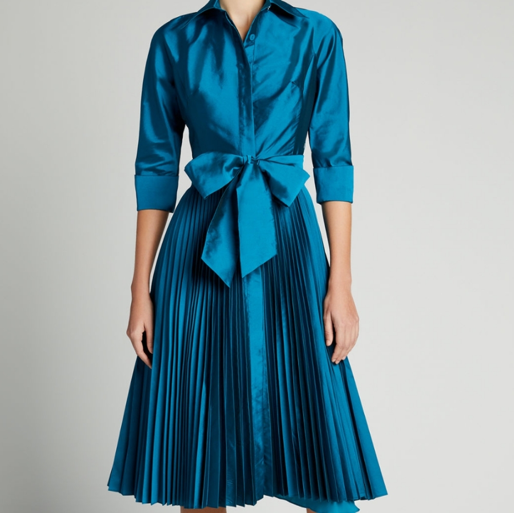 Beautiful turquoise taffeta pleated dress. New without tags. Never worn. Size 14